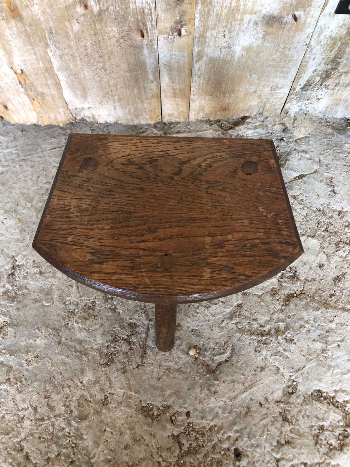 Old vintage wooden tripod milking stool