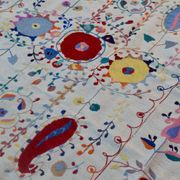 White suzani kilim rug with hand embroidered multi-colored patterns
