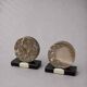 Vintage pair of bookends in fossilised coral agate | Stone disc-shaped bookends on a black marble base