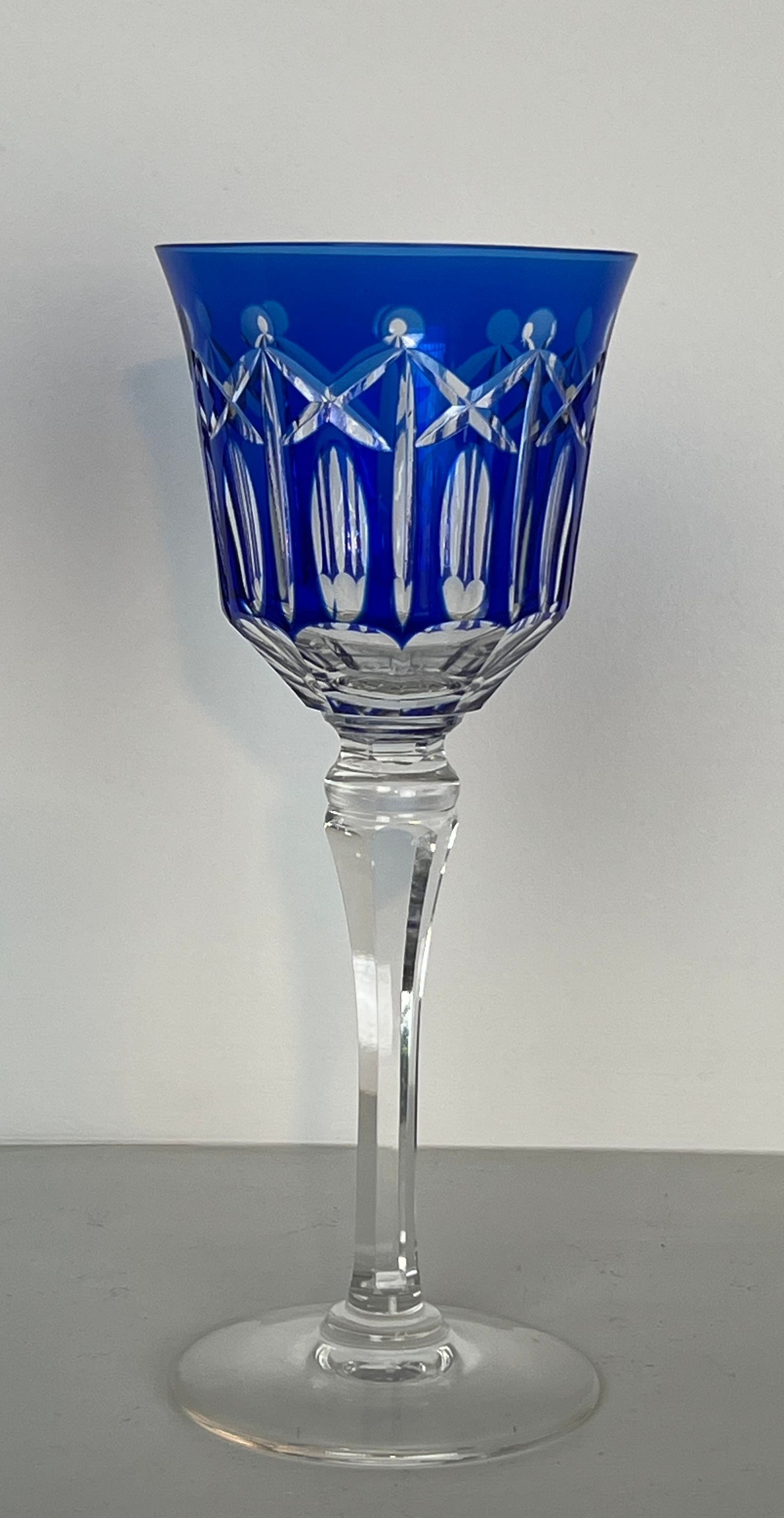 Set of twelve glasses in crystal tinted in different colours and cut with stars.