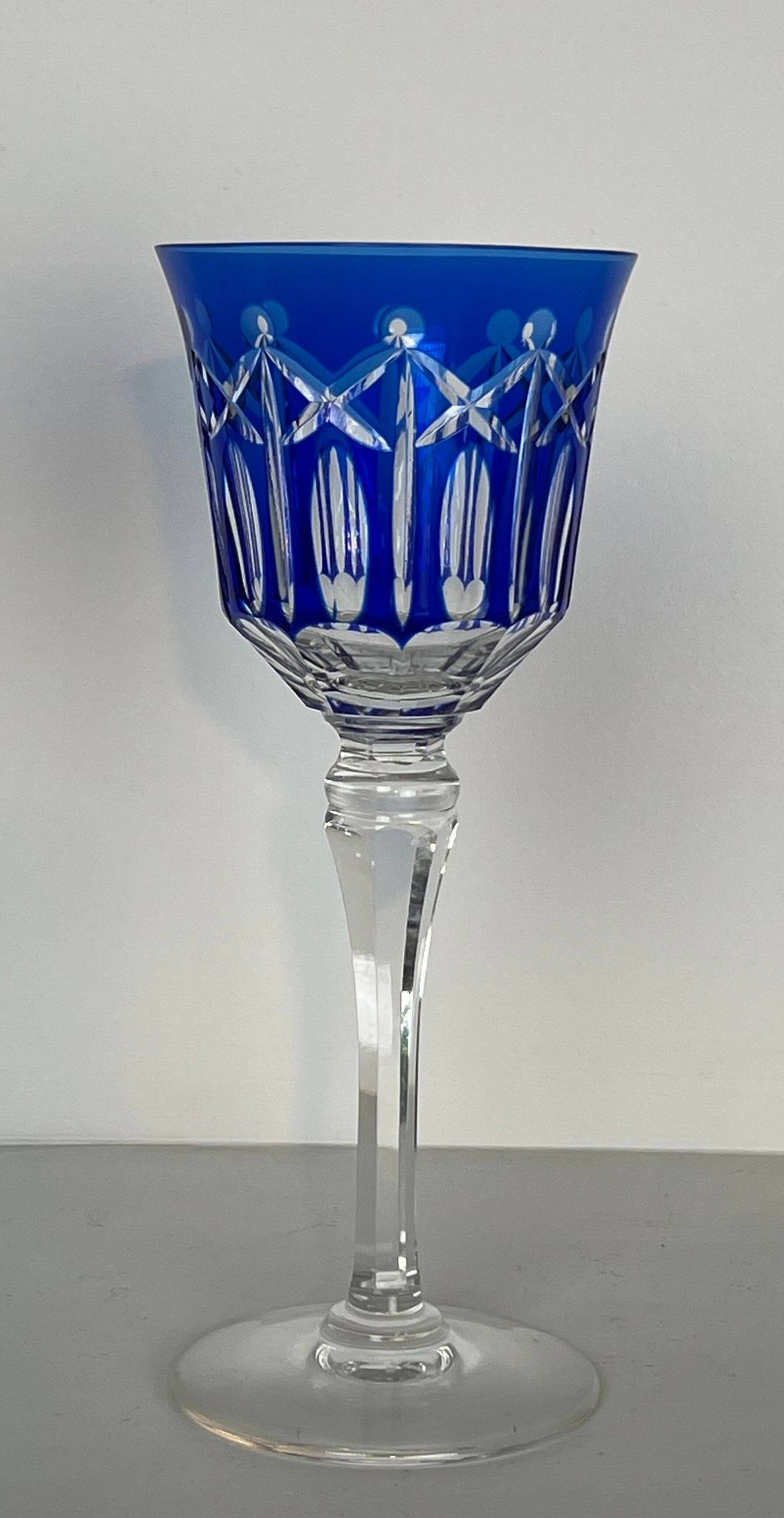 Set of twelve glasses in crystal tinted in different colours and cut with stars.