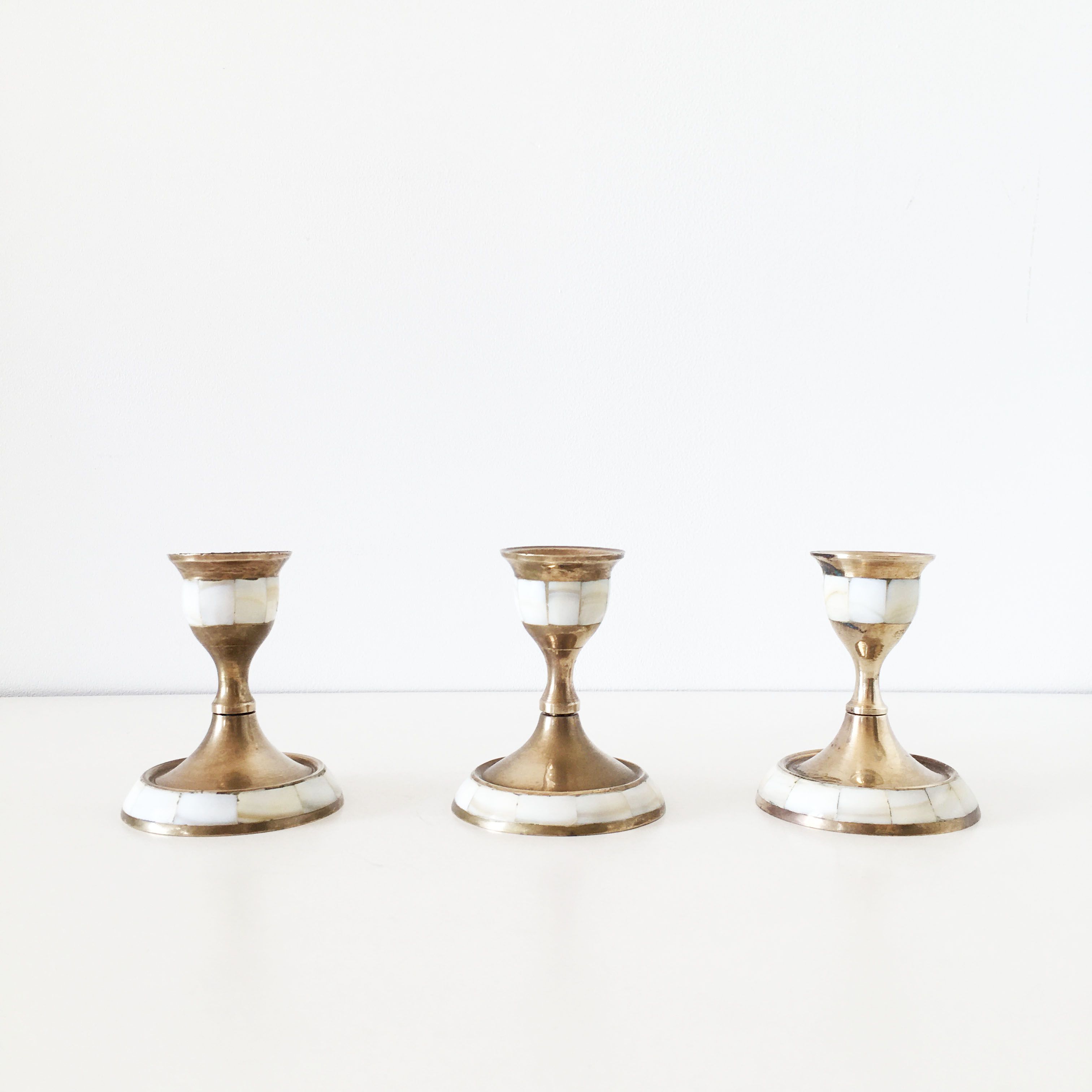 Lot of old candlesticks in brass and mother-of-pearl