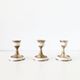 Lot of old candlesticks in brass and mother-of-pearl