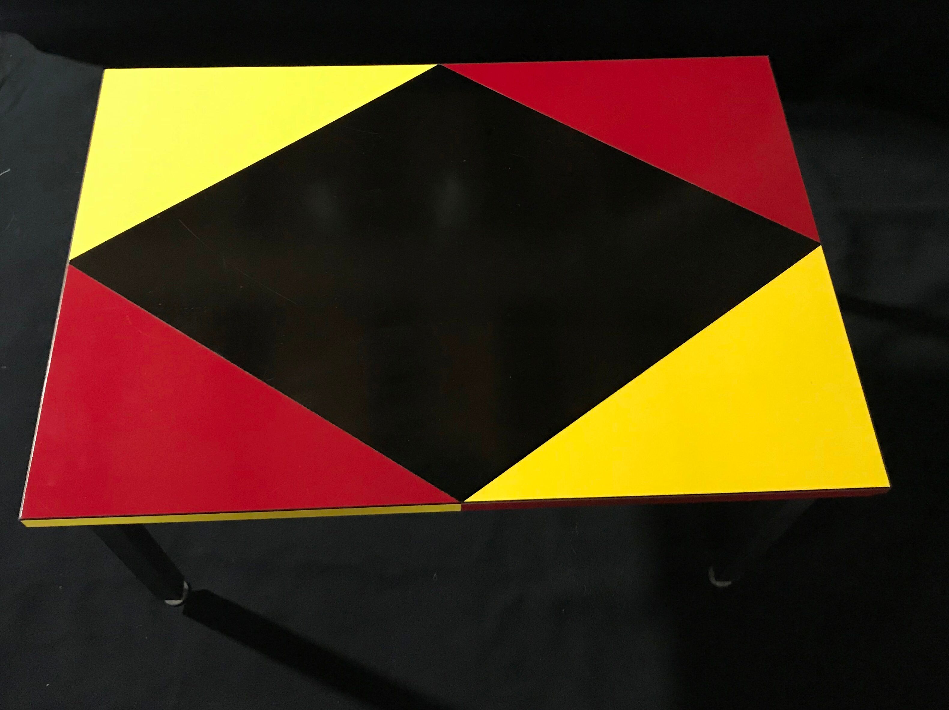 Metal foot coffee table, formica coating, red and yellow black geometry design