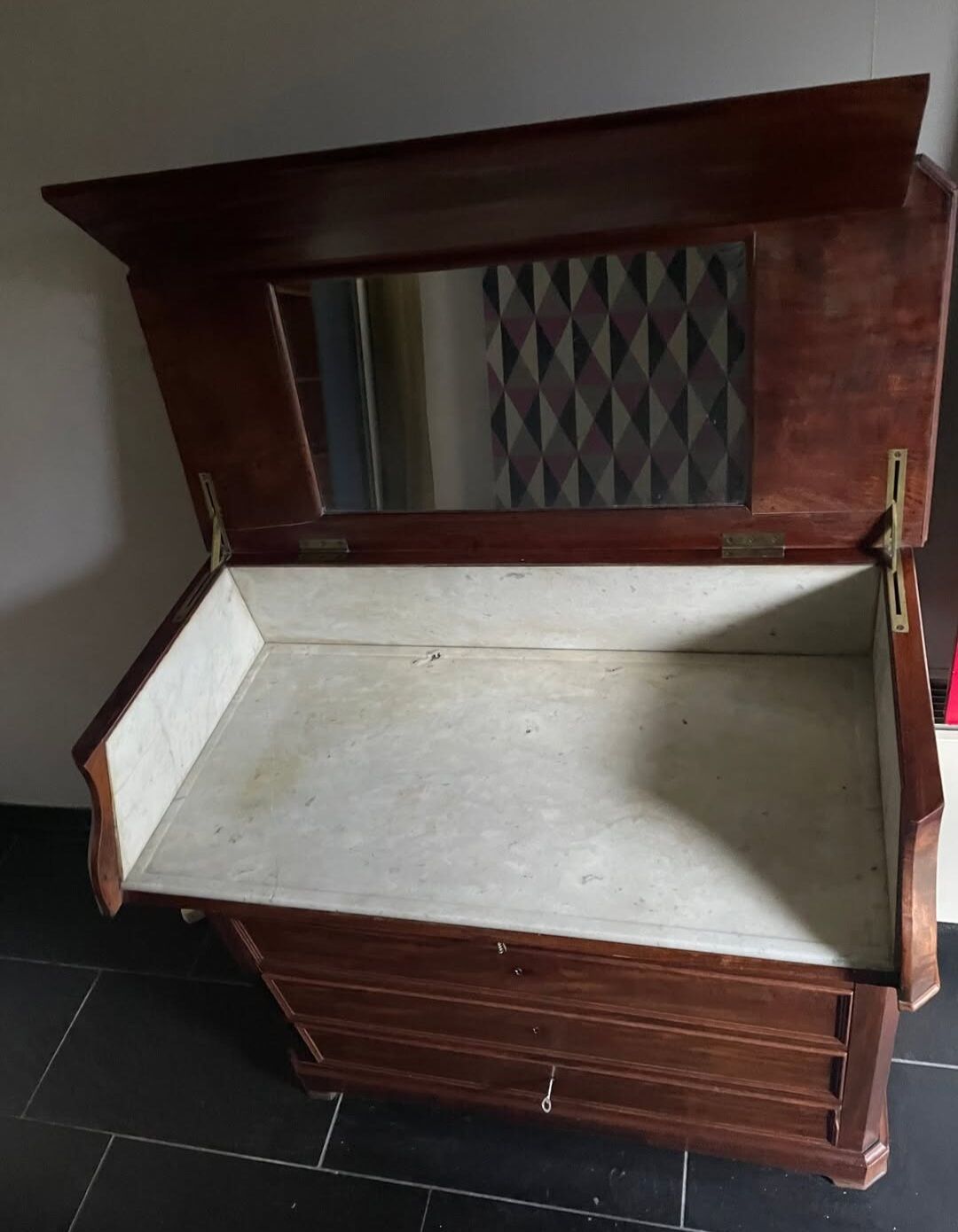 Vintage wooden toilet commode with marble top.