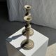 Pair of classic candlesticks in patinated gold metal H25