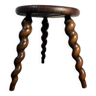 Round tripod stool made of turned wood