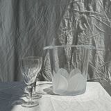 Glass ice or champagne bucket with stylized petal patterns