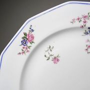 4 flat plates by Bernardaud, Limoges porcelain, floral decoration from the 1920s to 1950s.