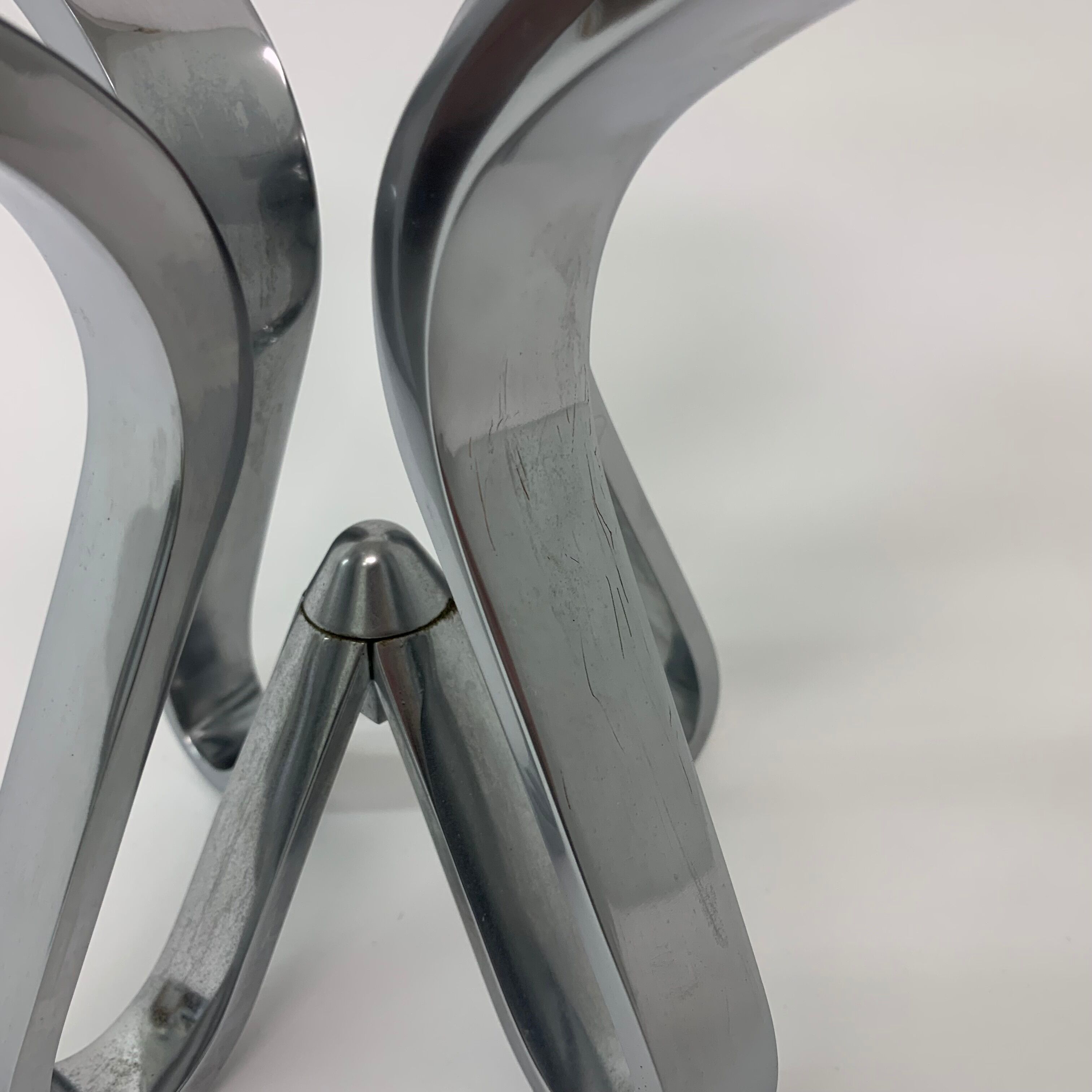 A chromed metal candle-holder "Chorus", design Karim Rashid, executed by Umbra / USA 2002