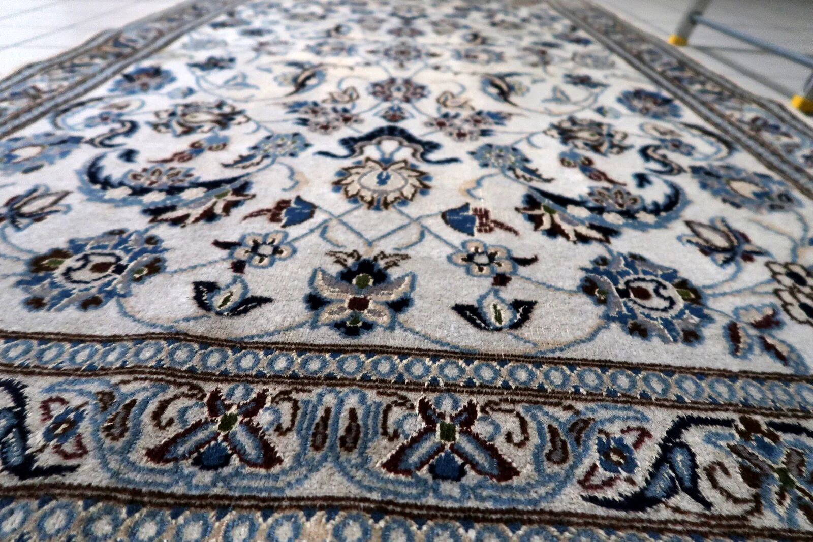 1950s hand-knotted wool rug with silk highlights, ivory and blue, 118 × 200 cm