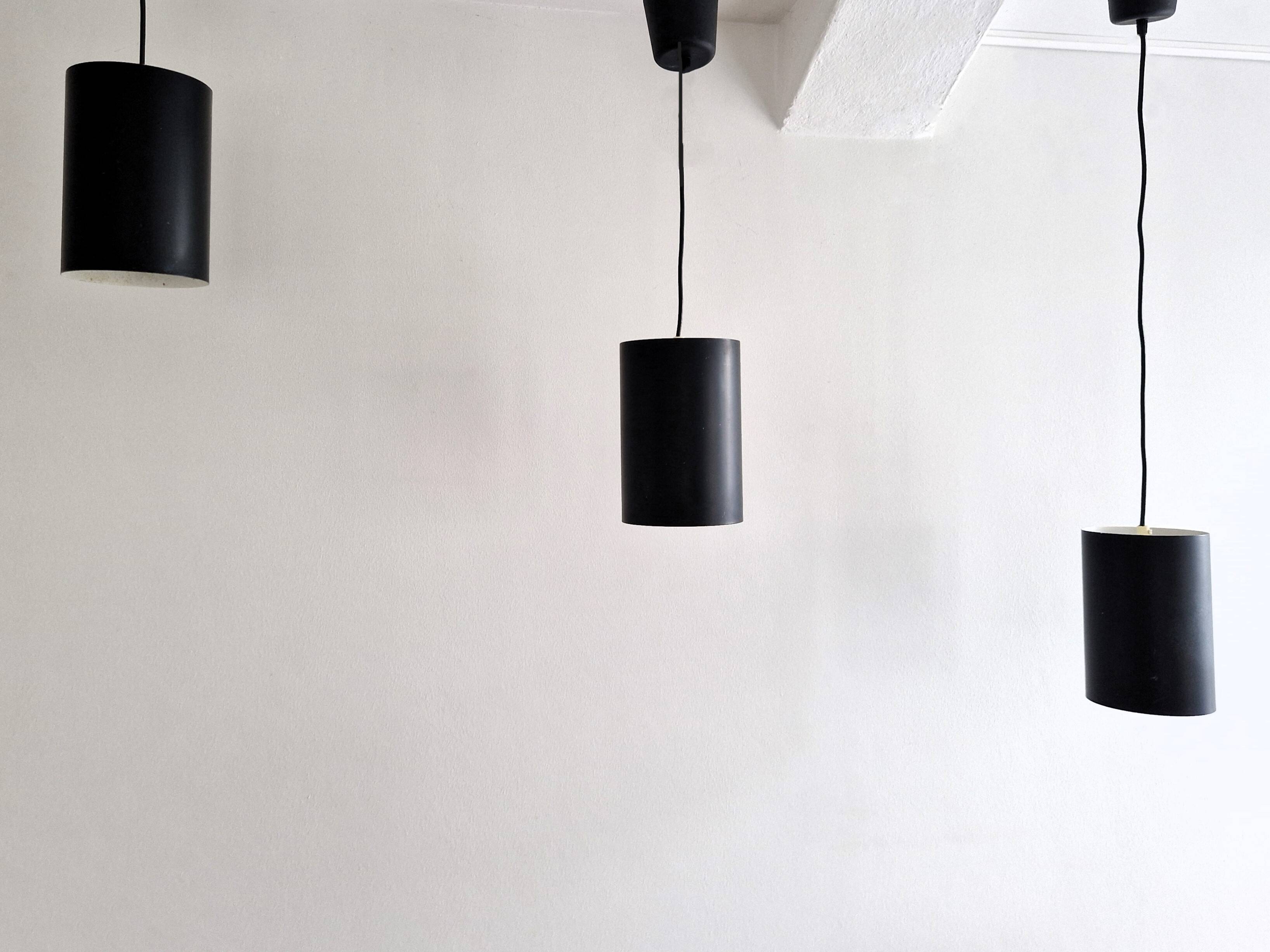 Set of 3 black cylinder pendant lamps, by Eila & John Meiling for Louis Poulsen, Denmark 1967