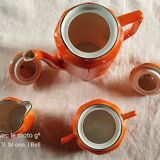 Iridescent orange porcelain coffee set from the 50s-60s with black edging