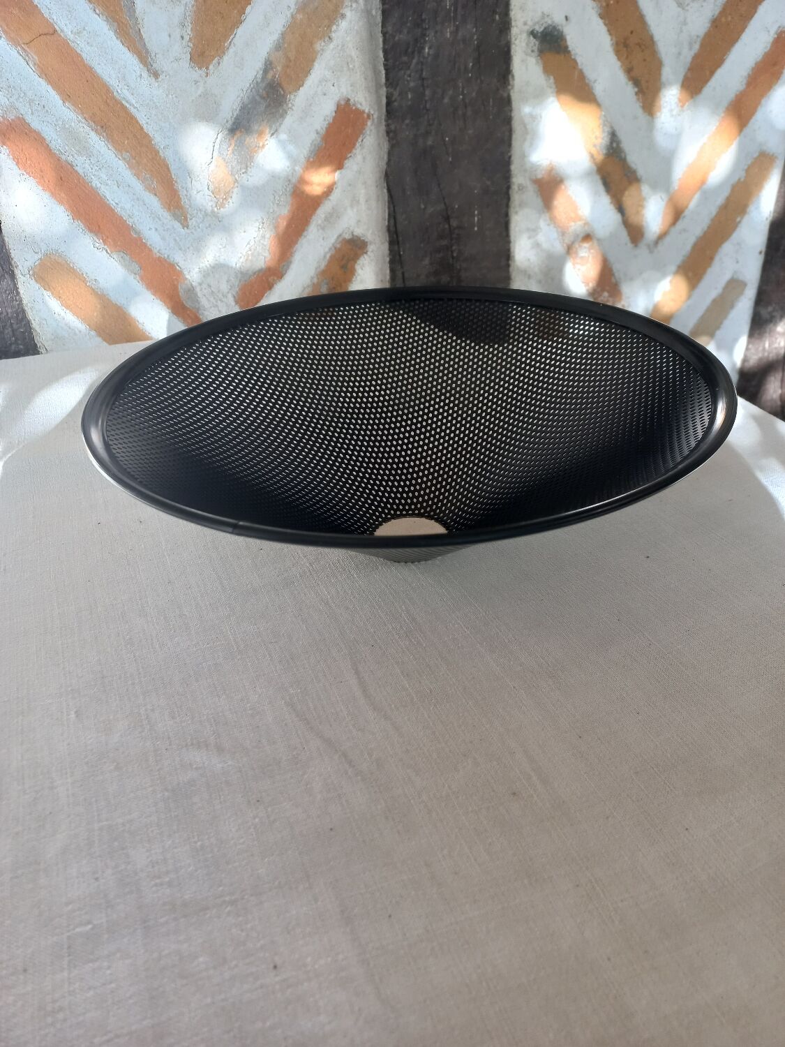 Black perforated metal day abatement