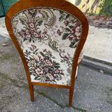 Louis XV Voltaire armchair in solid wood and floral fabric.