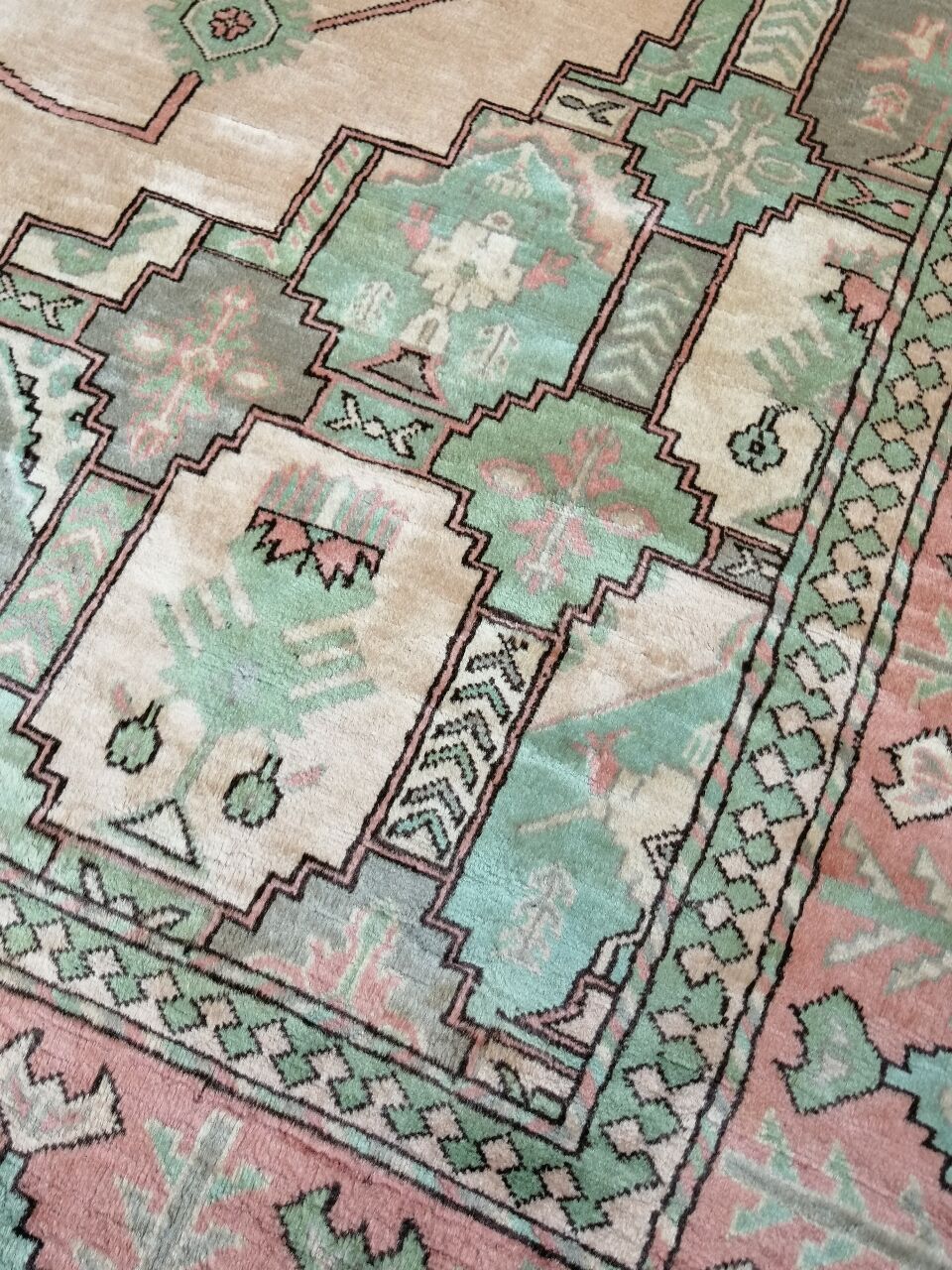 Afghan rug in pastel colors