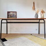 Metal tubular base table with a wooden top.