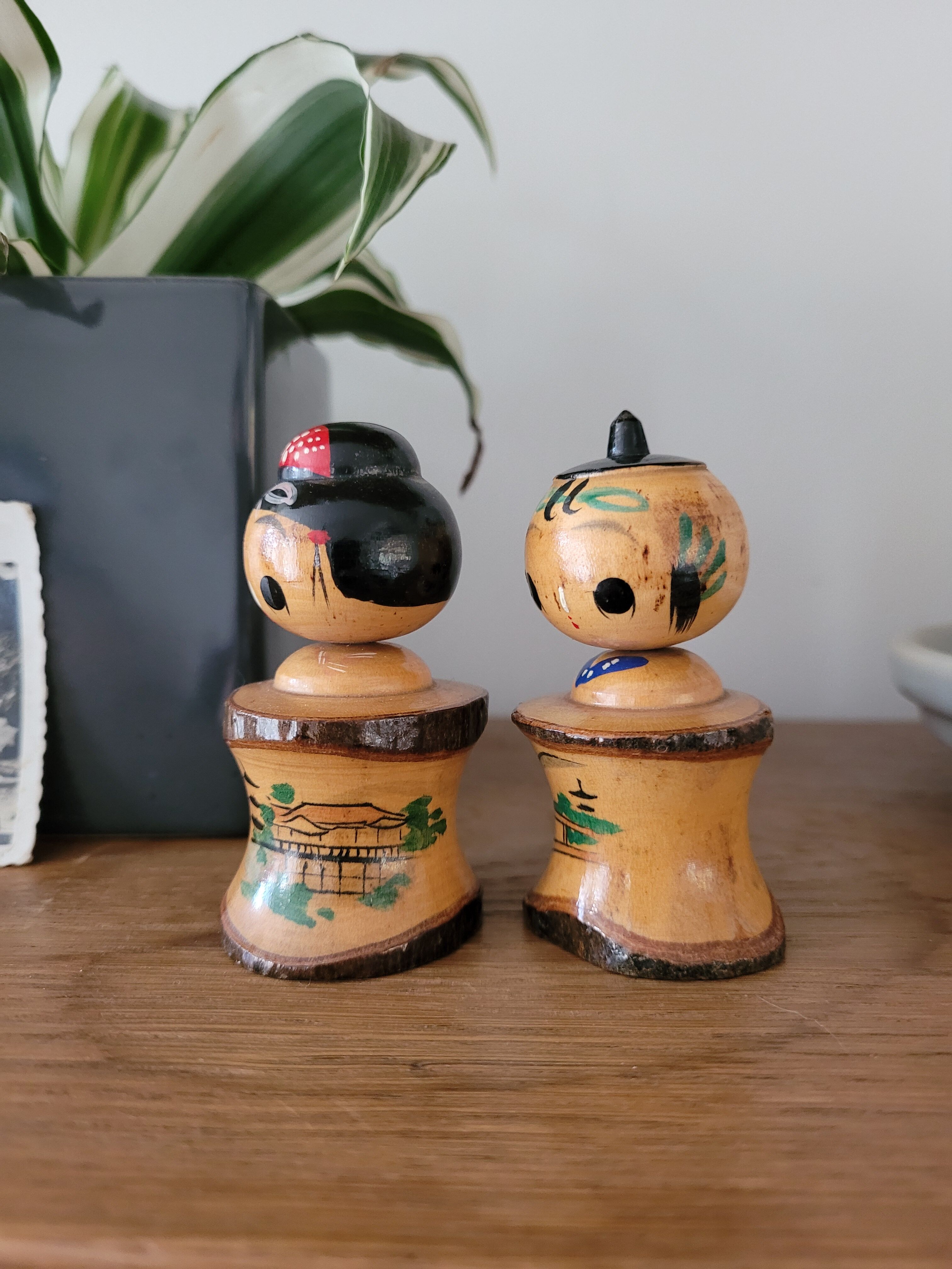 Two Kokeshi dolls