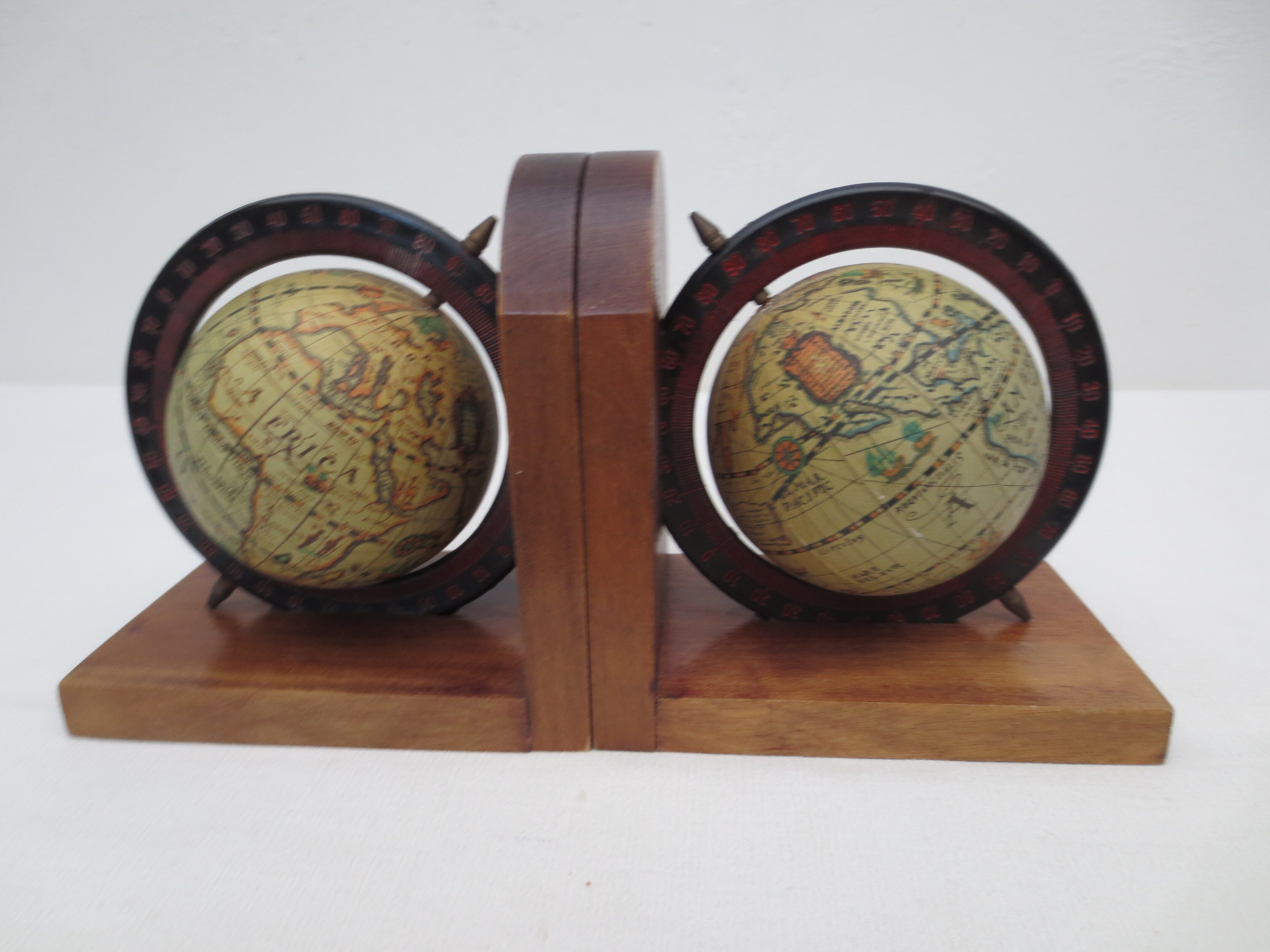 Old pair of greenhouse books in solid wood and world map