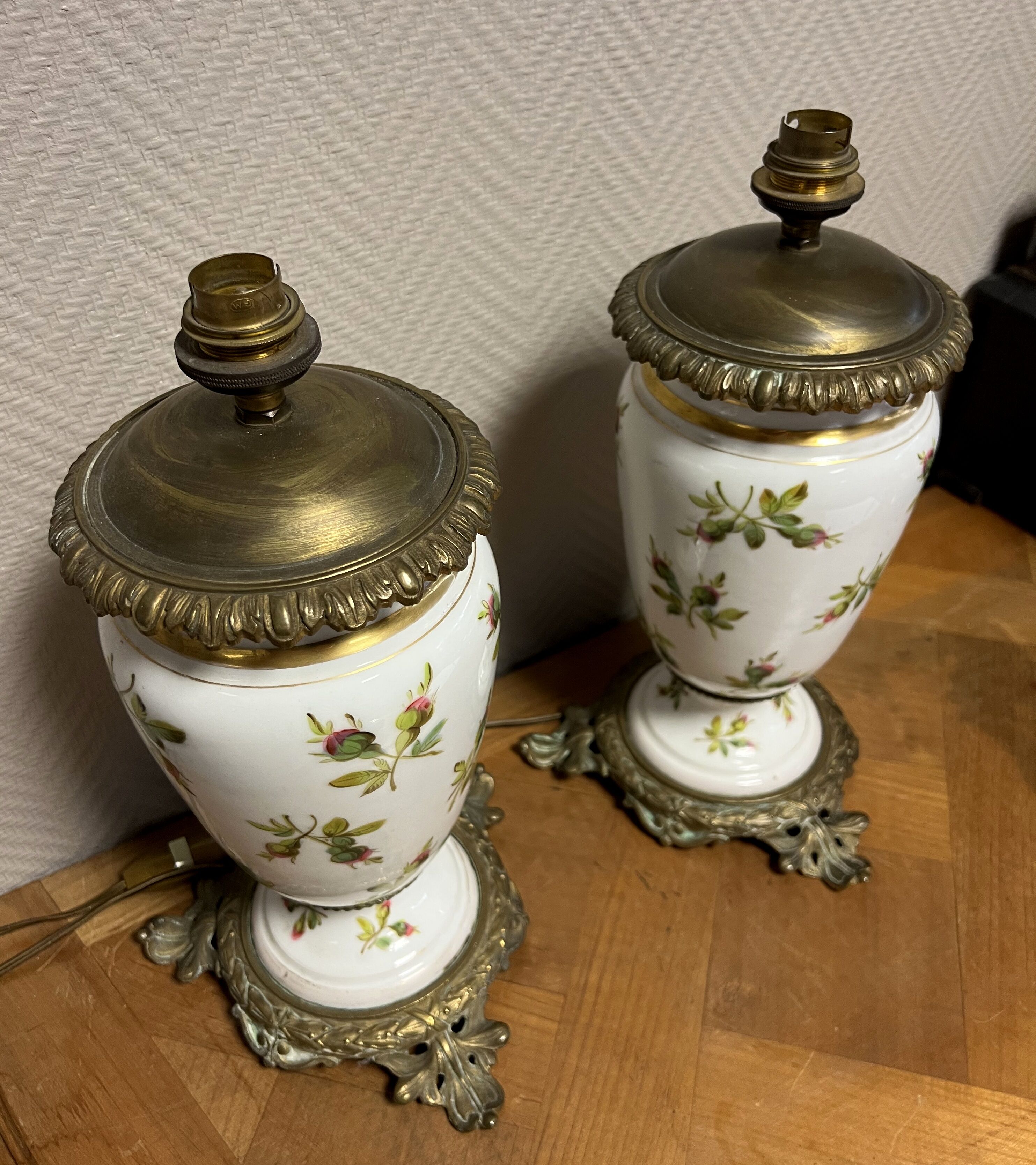 Old pair of porcelain oil lamps decorated circa 1900