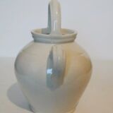 Old jug chevrette gargoulette in varnished white sandstone