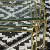 Nesting tables in gold-tone metal and glass