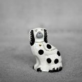 Vintage ceramic figurine from Staffordshire depicting a spaniel dog, England.