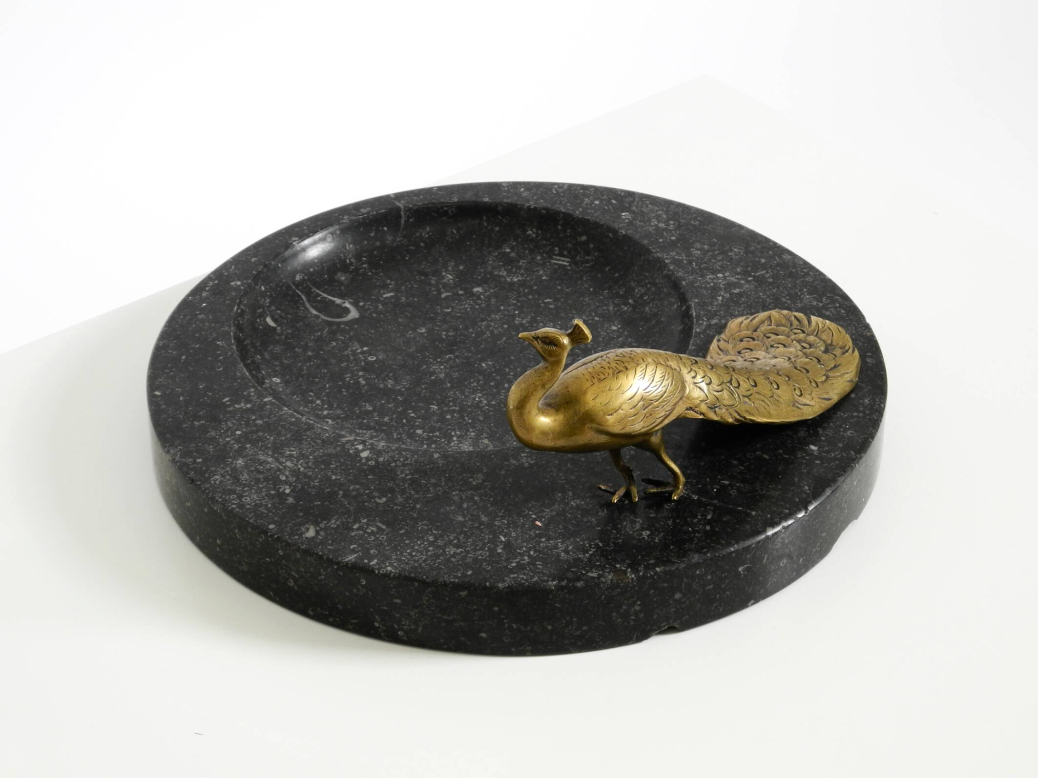Beautiful, large black granite valet tray featuring a brass peacock, circa