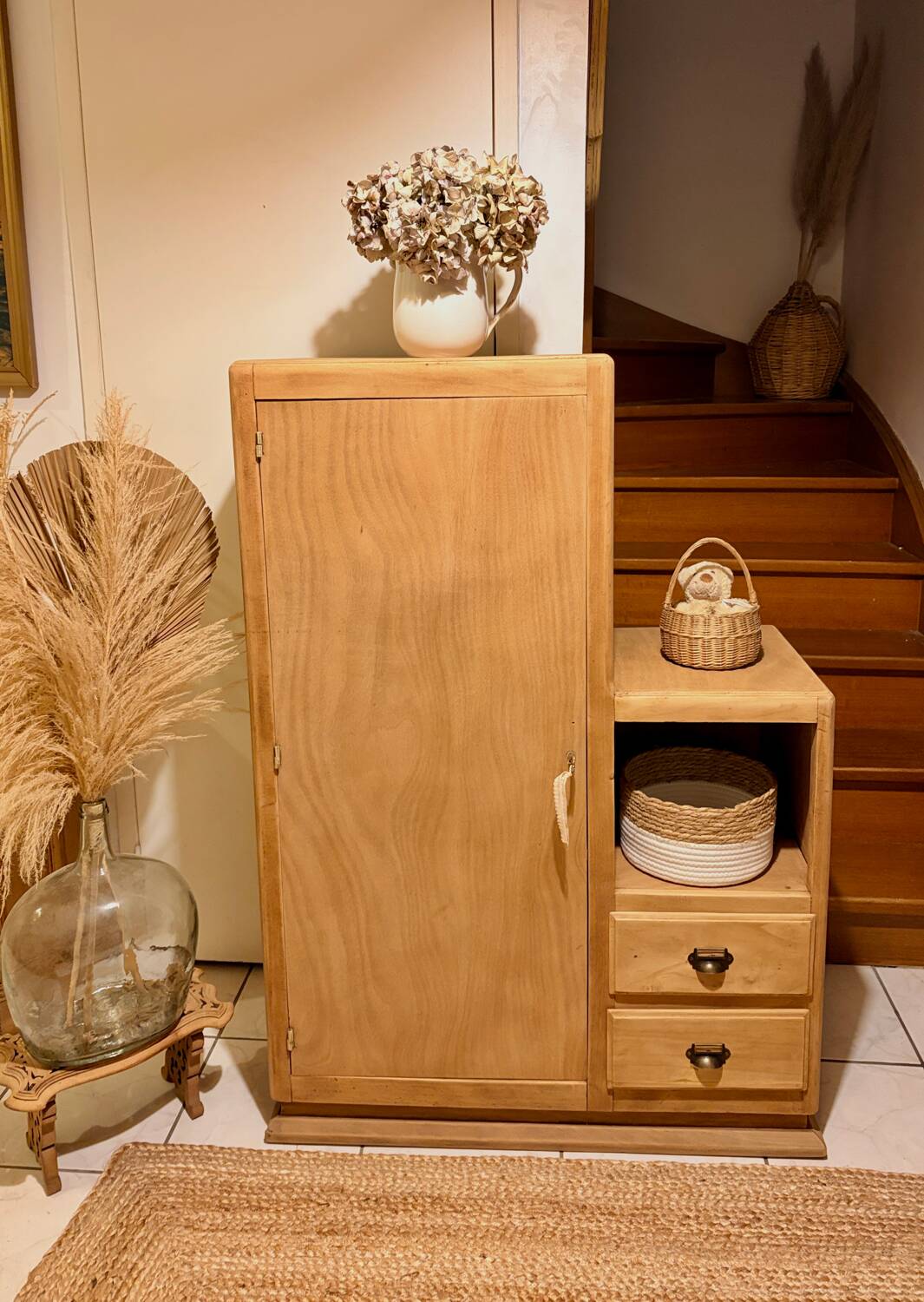 Asymmetrical cabinet made of raw wood