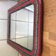 Antique Louis Philippe mirror in wood and plaster with a row of pearls and vintage friezes