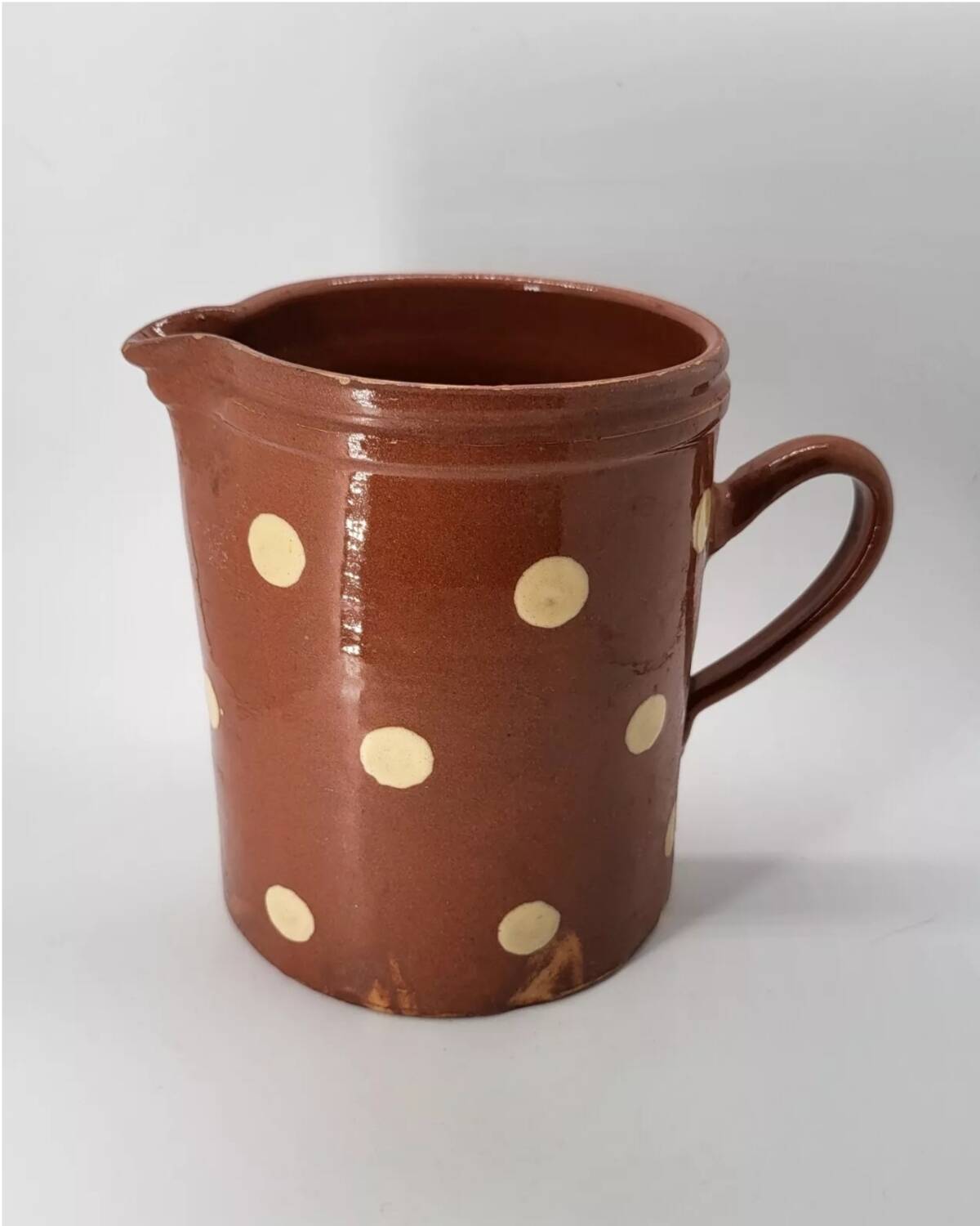 Old pitcher with polka dots savoyard pottery in glazed terracotta alsace
