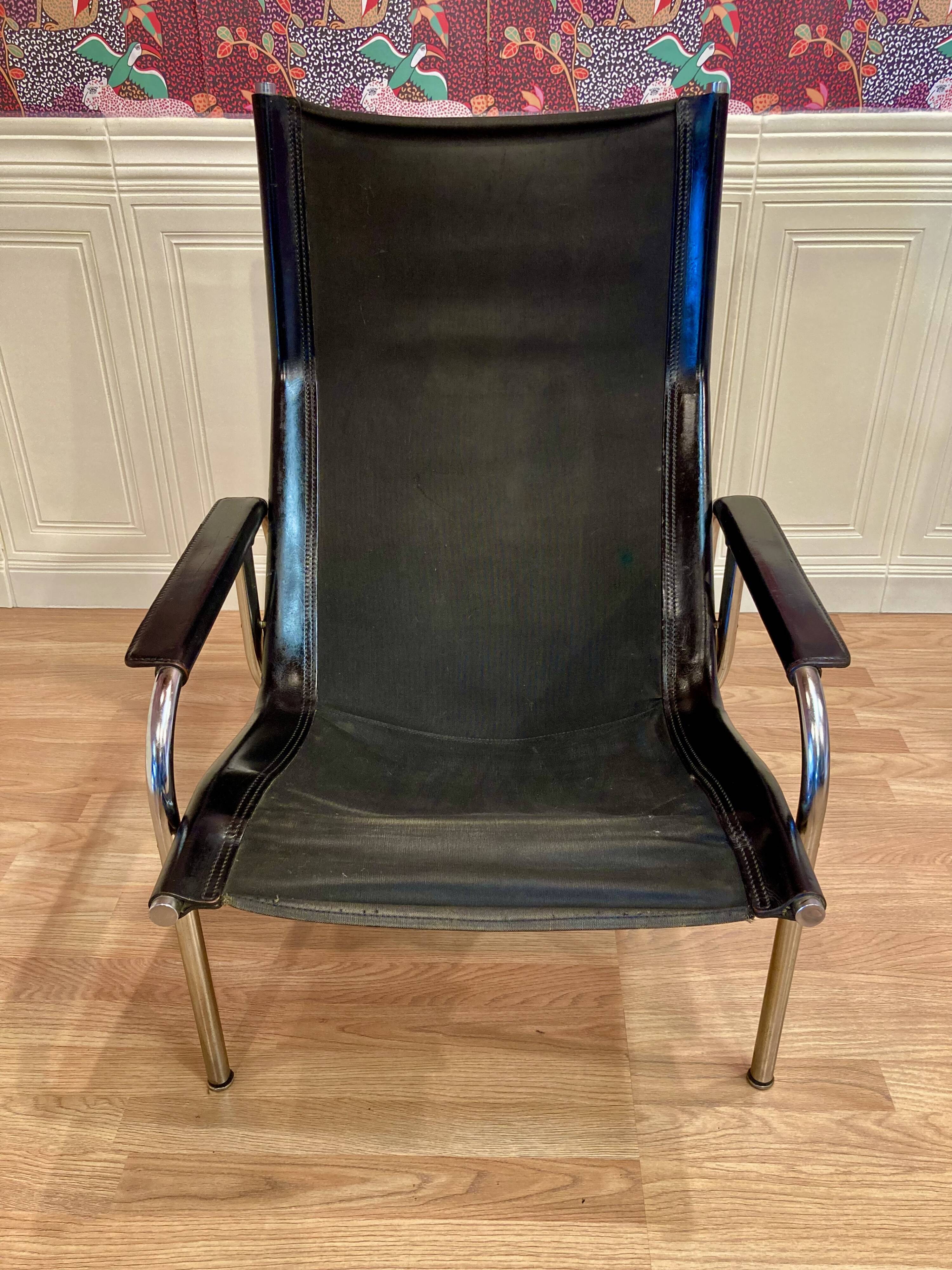 Reclining armchair in black leather and chrome design "hans eichenberger" 1960.
