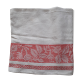 White damask tablecloth. Breve. Large red entourage.