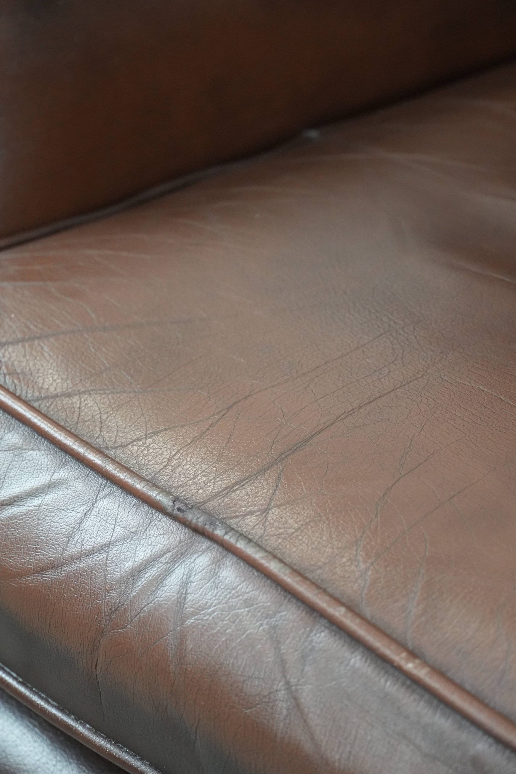 Brown smooth cow leather Chesterfield wingback armchair in English style