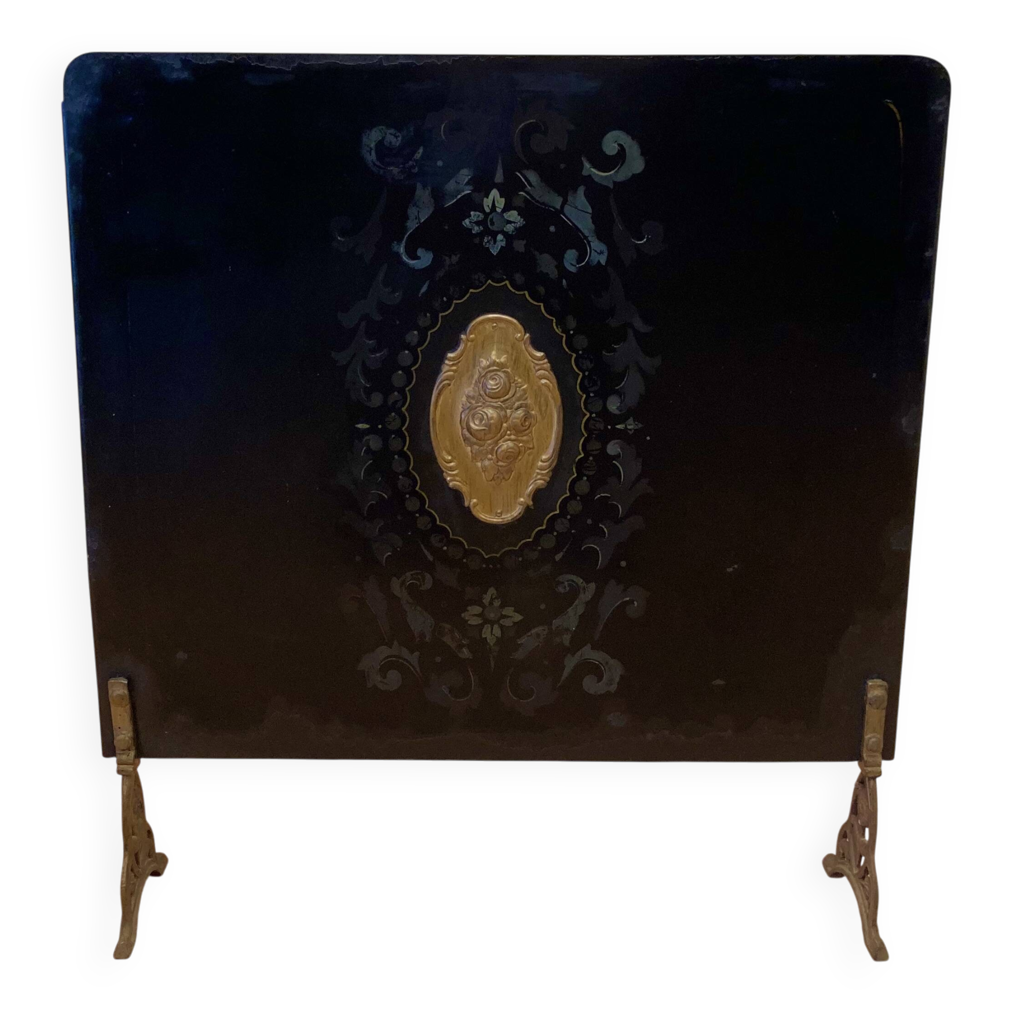 Antique metal fireplace screen.