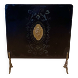 Antique metal fireplace screen.