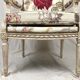 Louis XVI style armchair in white lacquered wood, 19th century