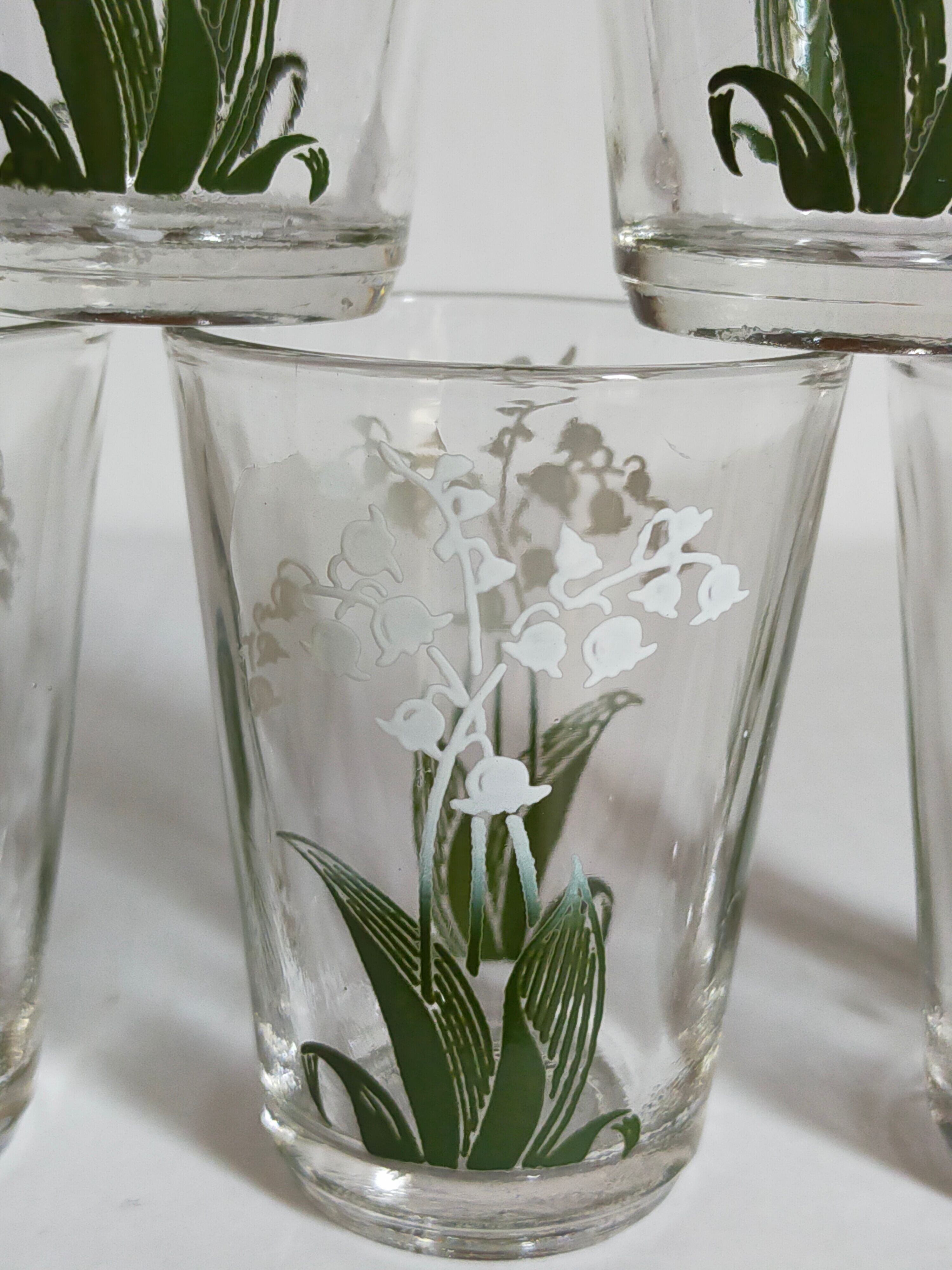 Seven glasses with digestive screen-printed with thrush, 30s