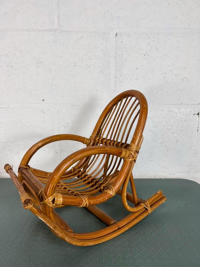 Vintage doll rocking chair in rattan