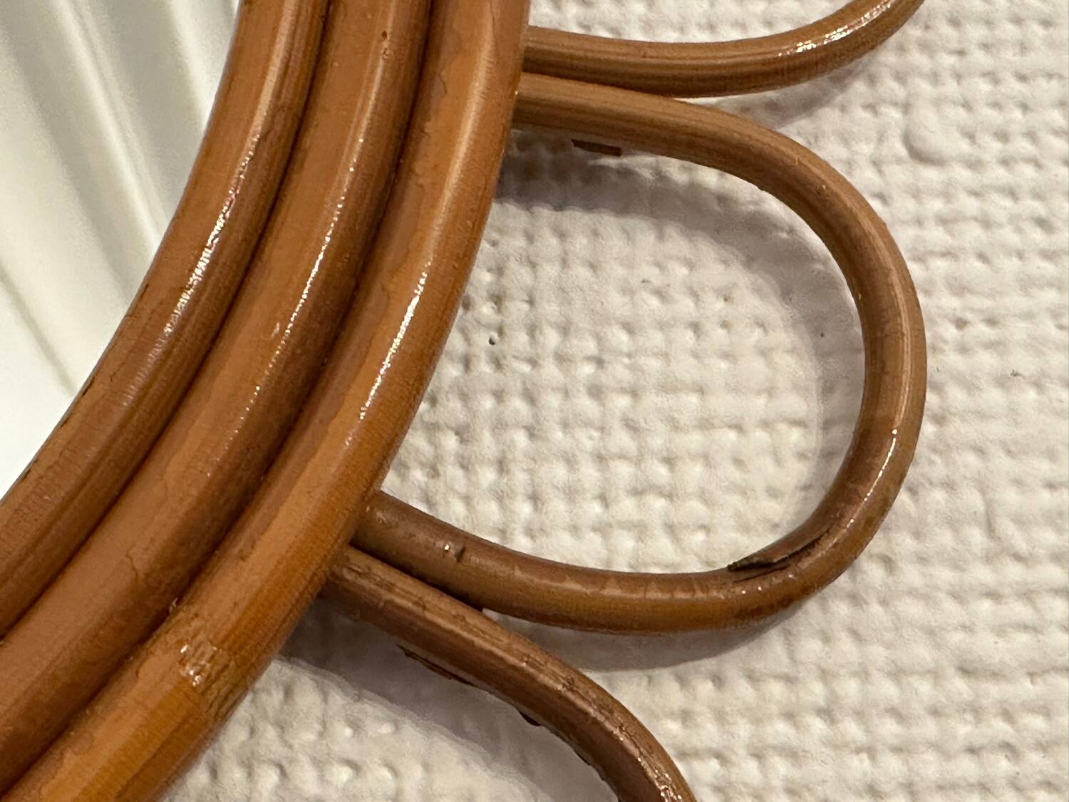 Old vintage asymmetrical round rattan mirror