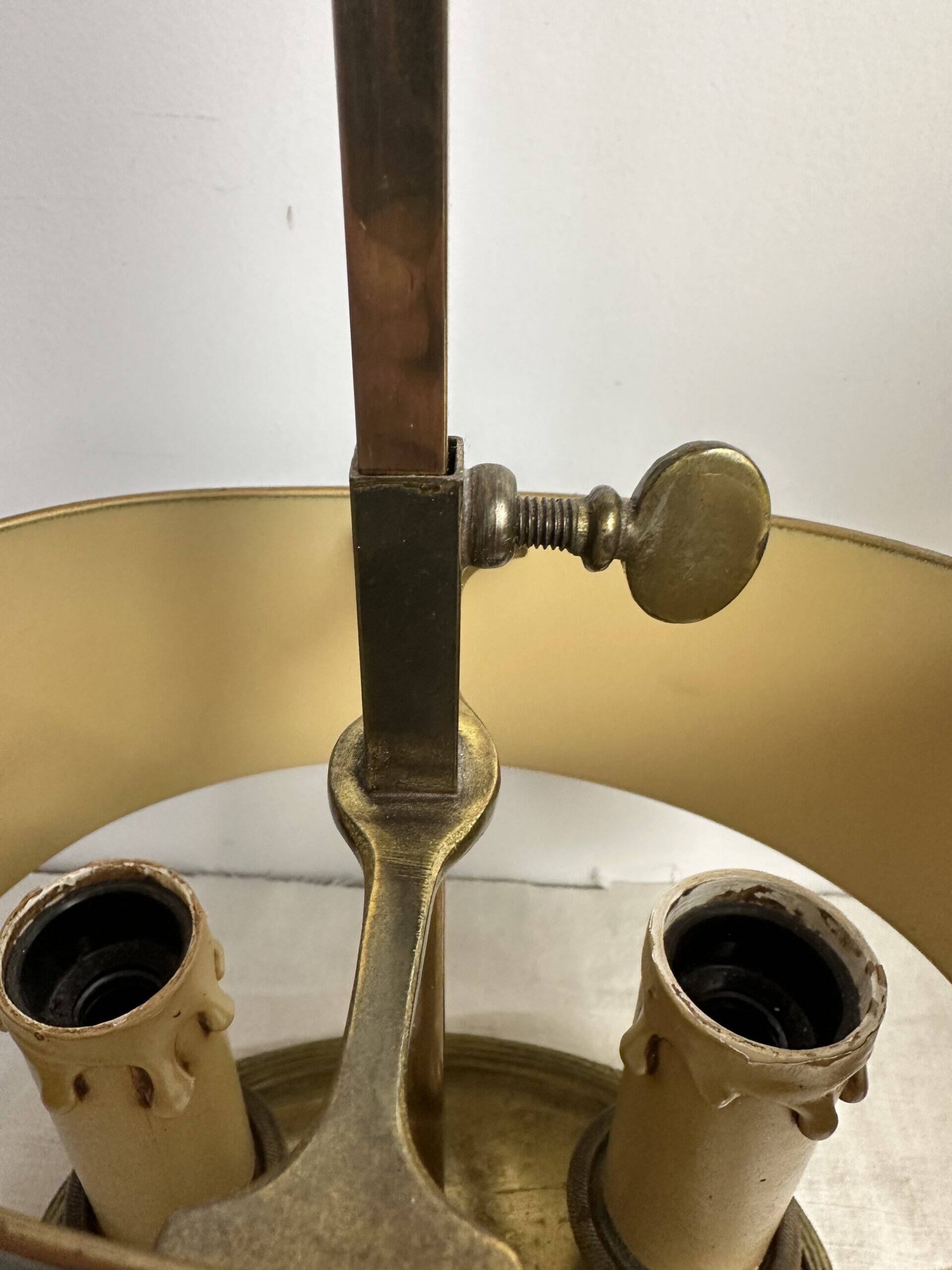 A pair of old brass bed warmers.