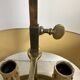 A pair of old brass bed warmers.