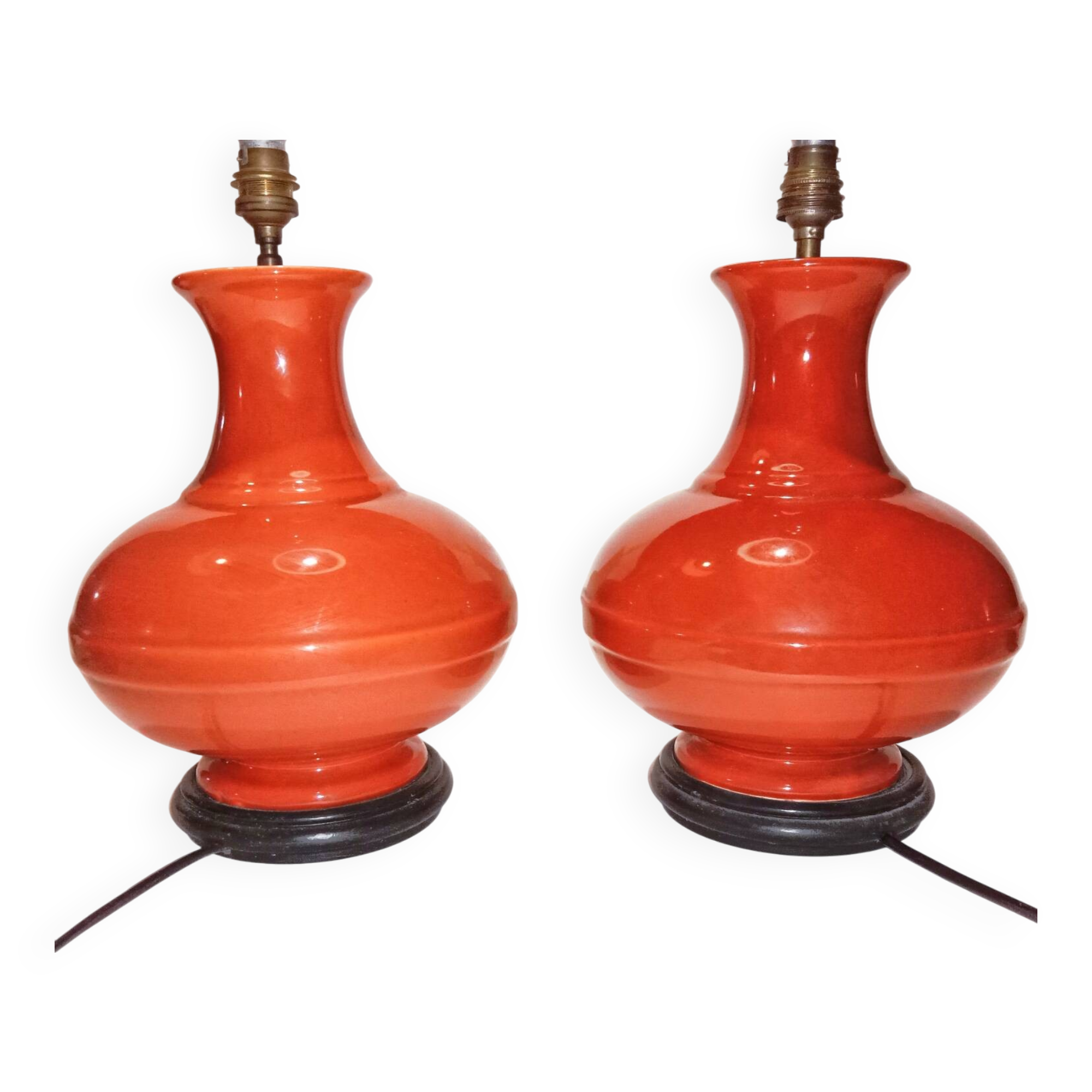 Pair of ceramic lamp bases in the shape of orange gourds.