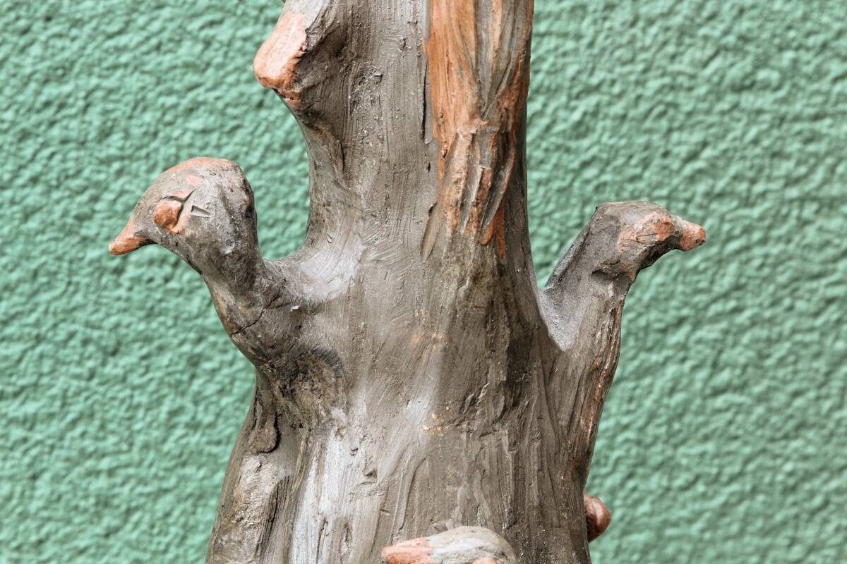 Lamp base in sculpted terracotta featuring birds, signed.