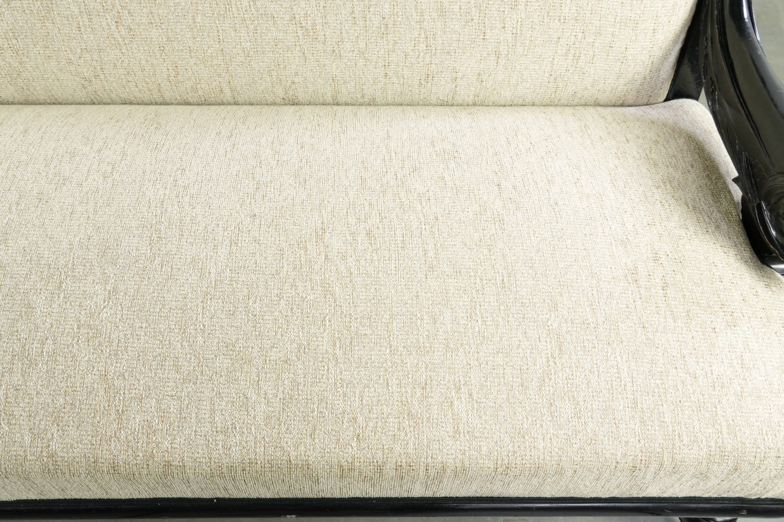 French sofa from the 19th century in Empire style with detailed armrests