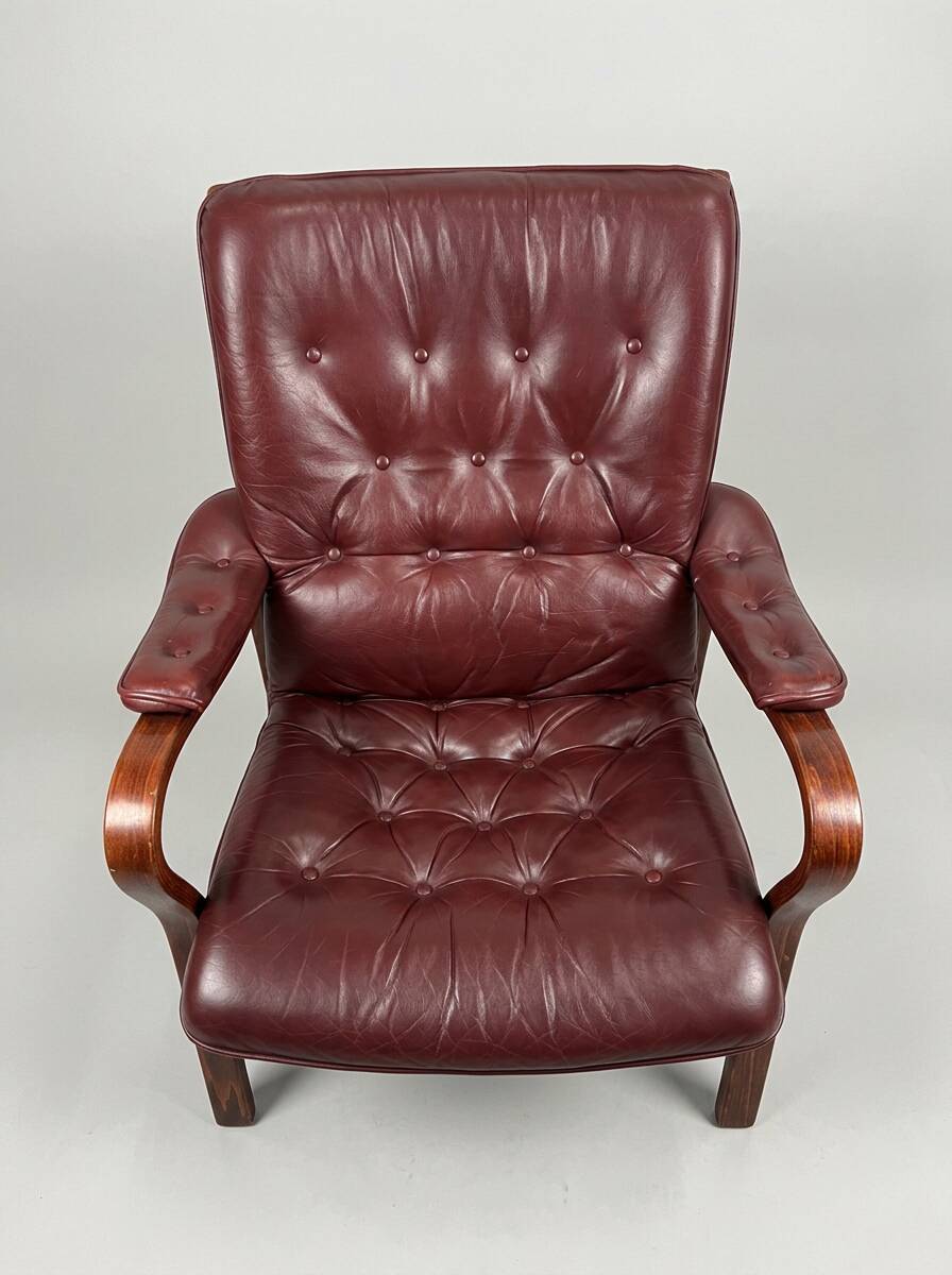 Scandinavian armchair with footrest