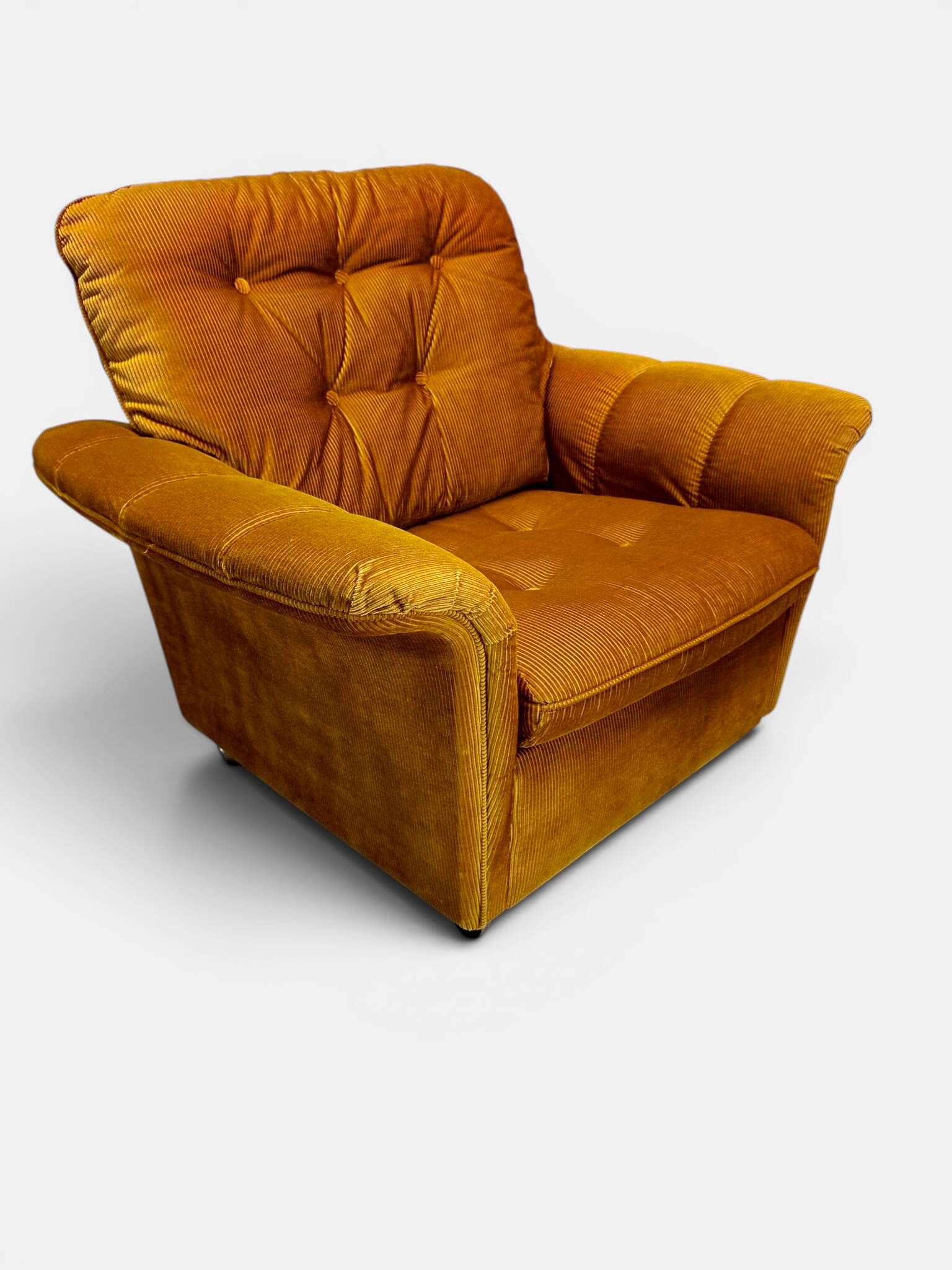 Vintage lounge chair on wheels in golden mustard corduroy 70s