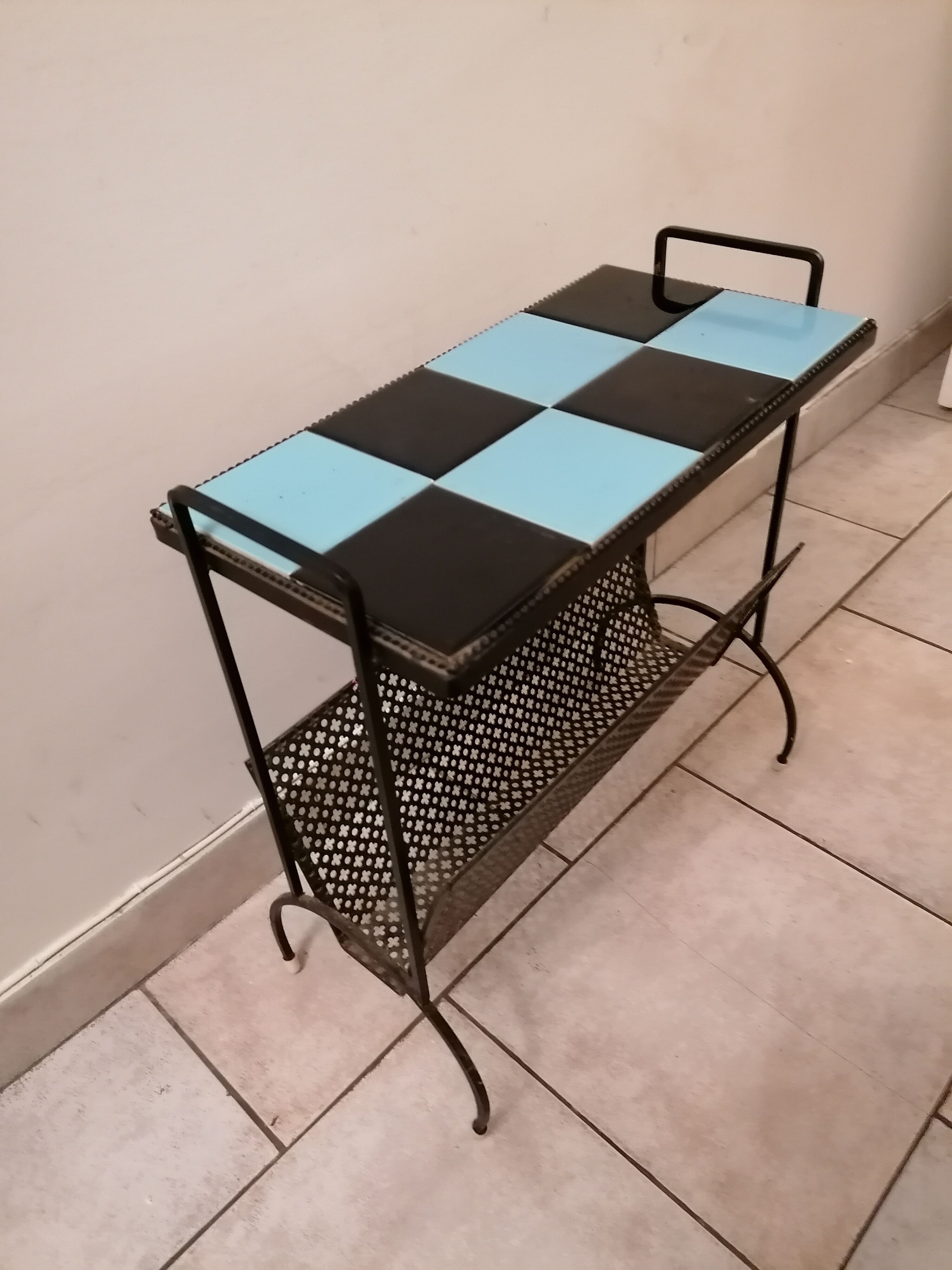 Table carries steel magazines perforated sheet metal vintage ceramic checkerboard