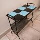 Table carries steel magazines perforated sheet metal vintage ceramic checkerboard