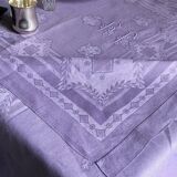 Old damask tablecloth in linen and purple silk